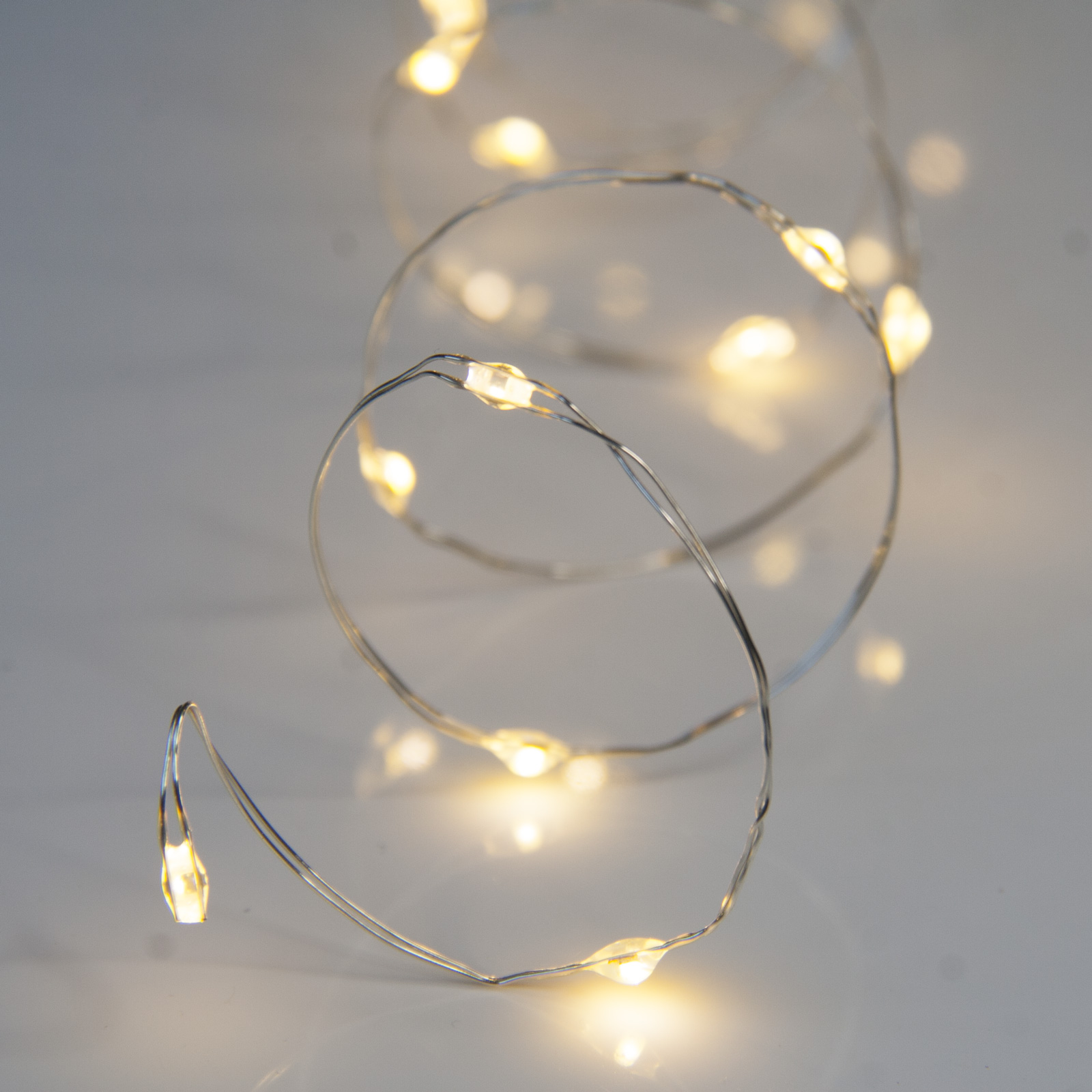20 Warm White Battery Powered Fairy Lights on Silver Wire. Firefly
